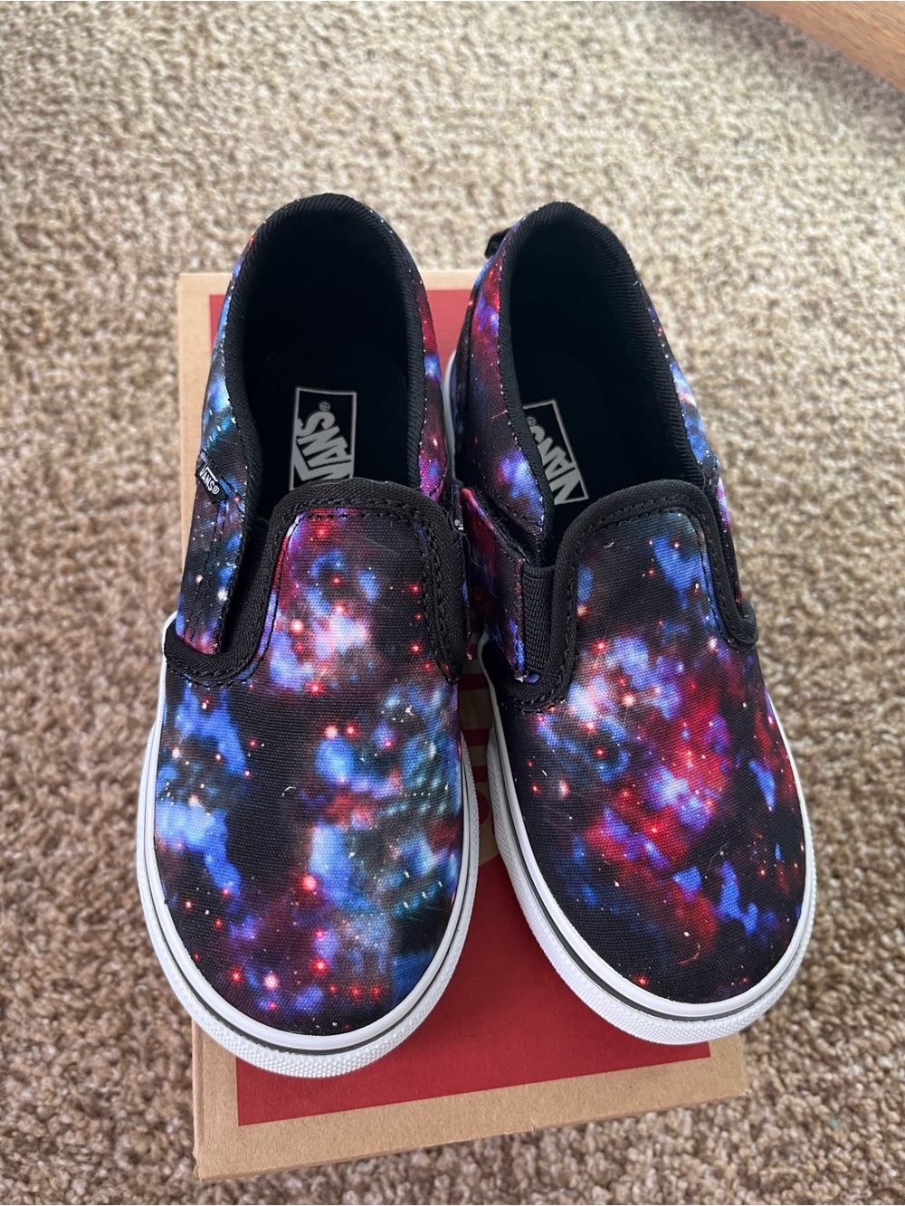 Vans Kids Slip-On Sneakers in Black with Blue & Red Galaxy Print